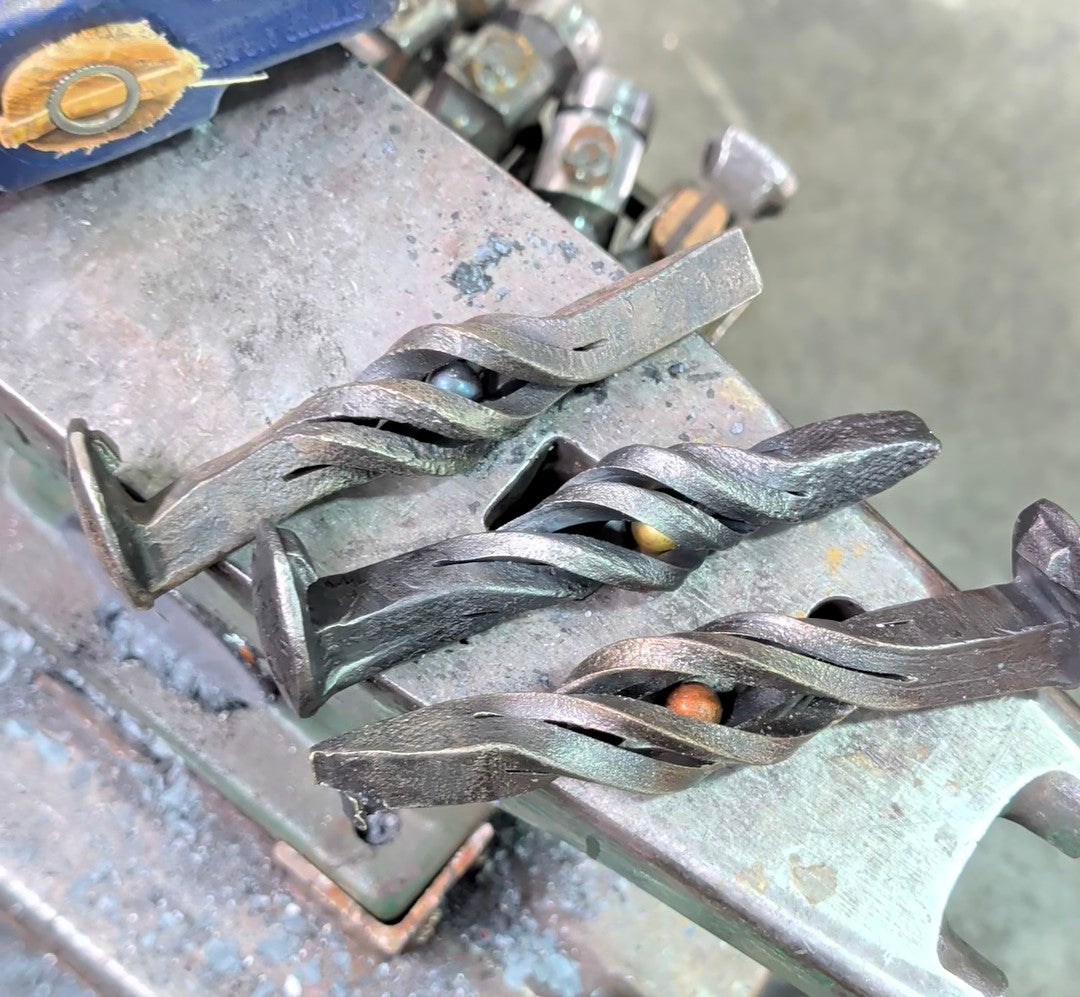 Railroad spike bottle opener