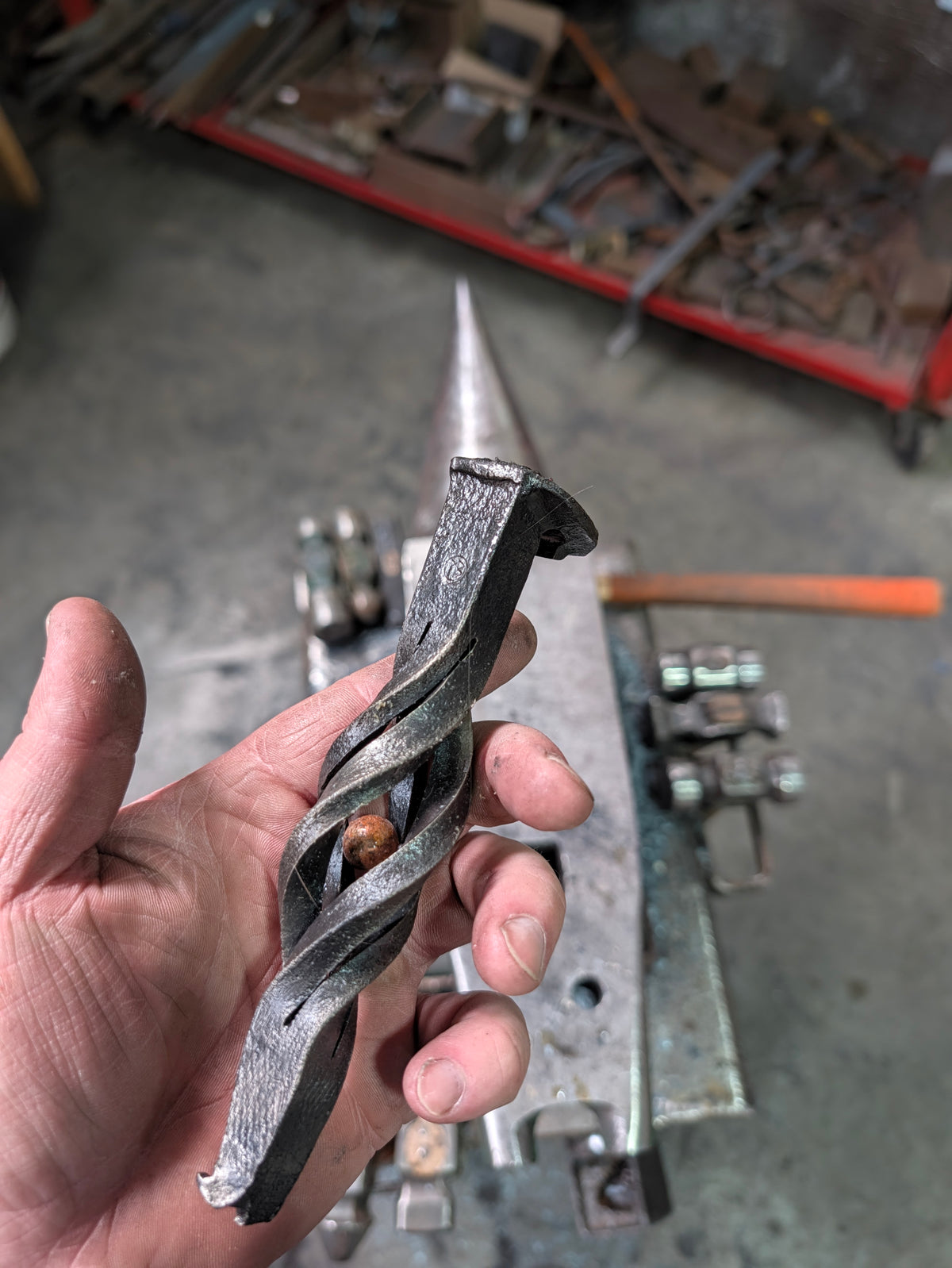 Railroad spike bottle opener